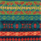 Detailaufnahme des Jacquard-Strickmusters der Beinstulpen Rosenheim in Grün, Rot und Blau