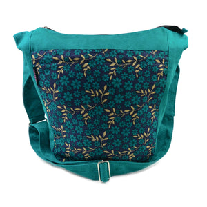 Umhängetasche Schultertasche Tasche aus Canvas-Stoff Türkis mit Blumenmuster.