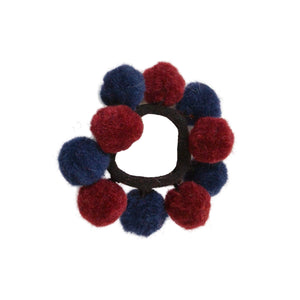Haargummi mit Bommeln aus Wollfilz in Dunkelrot-Blau, handgefilzt