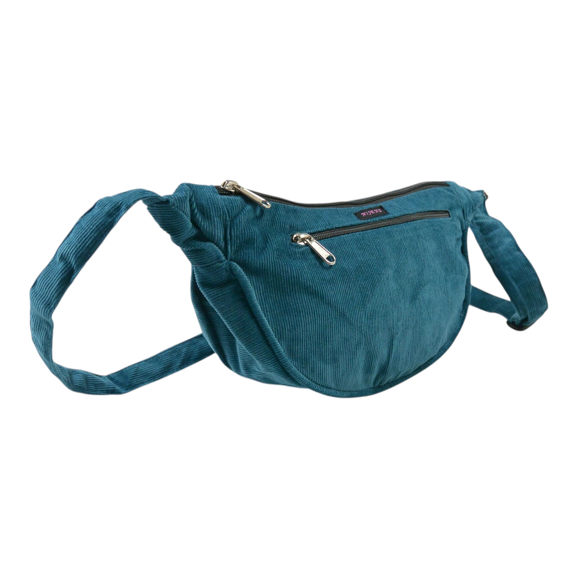 Petrolfarbene Crossbodybag „Rishikesh“ aus Cord von Nijens in Seitenansicht, mit zwei Reißverschlussfächern und verstellbarem Schultergurt
