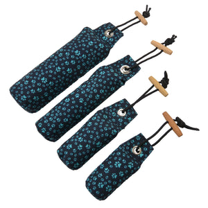 DOG BONE Wurf-Dummys, Polyesterstoff mit Pfotenmuster, Schwarz, Türkis.