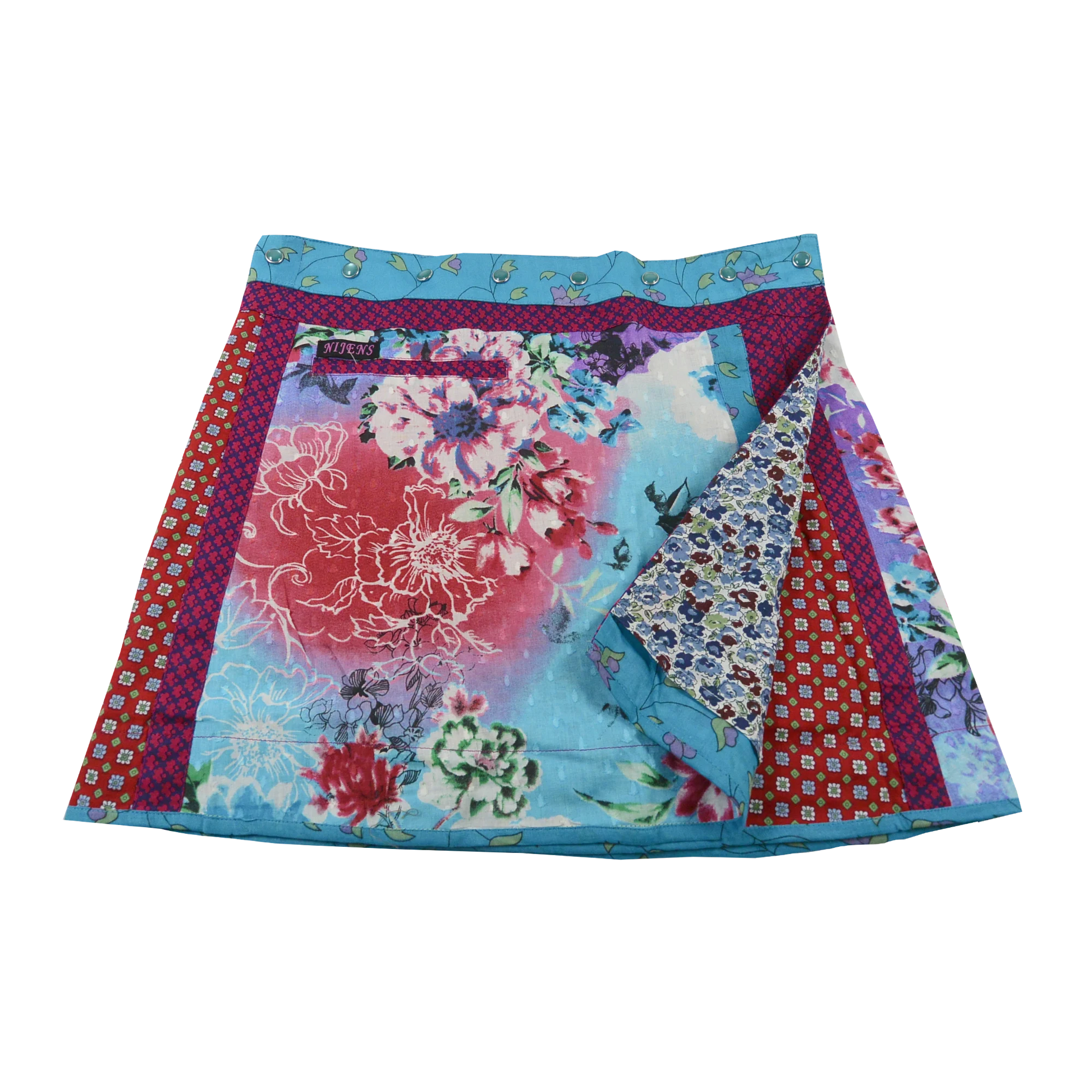 Wenderock aus Baumwolle mit Blumenmotiven (Hellblau, Rosa) mit kleinem Einsteckfach vorne. Umfang ist einstellbar mit gläsernen Druckknöpfen am Rockbund. Muster und Farbenmix.