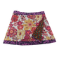 Wenderock aus Baumwolle mit Blumenmuster (weiß, bunt). Umfang ist einstellbar mit Druckknöpfen am Rockbund. Muster und Farbenmix.