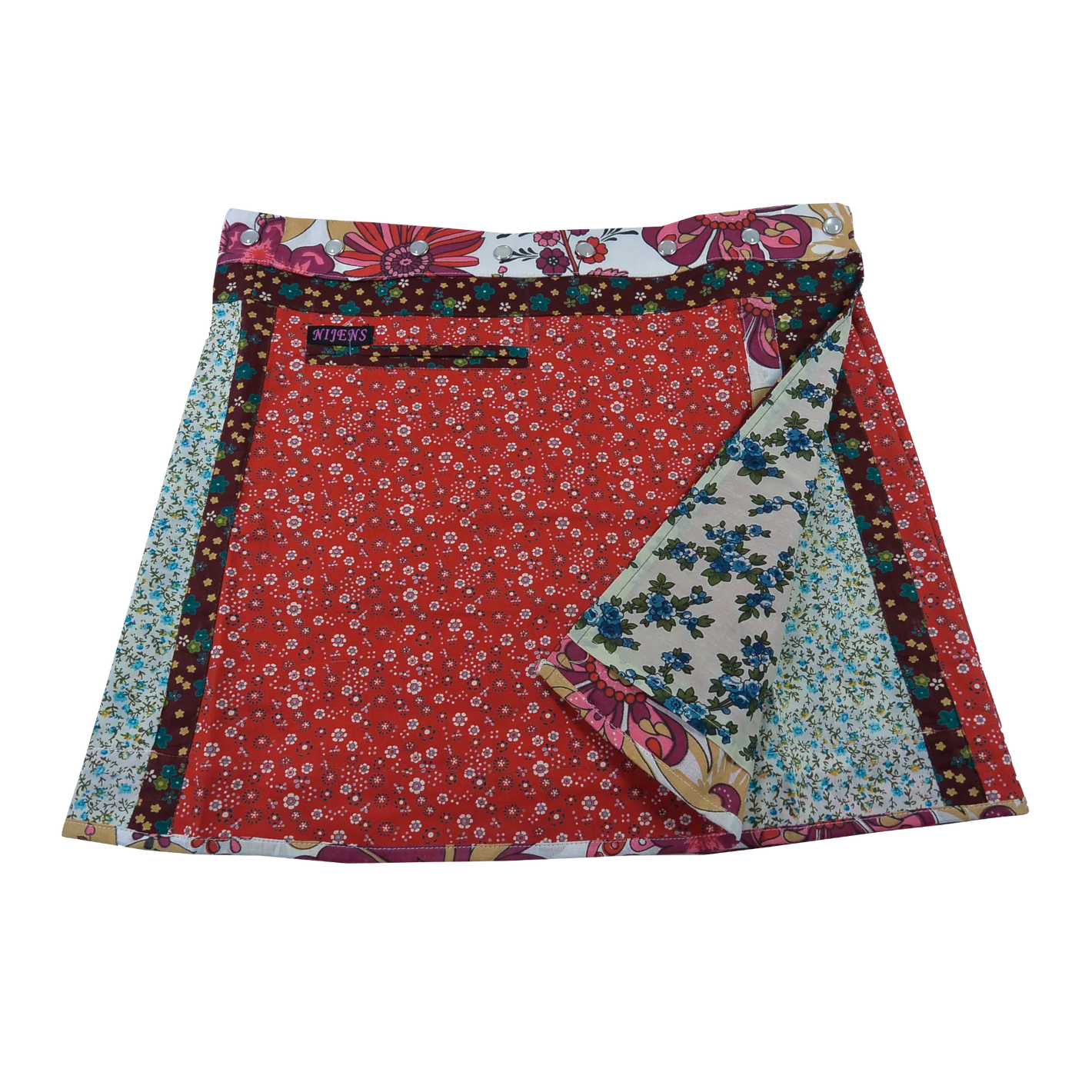Wenderock aus Baumwolle mit Blumenmuster (rot, weiß) mit kleinem Einsteckfach vorne. Umfang ist einstellbar mit gläsernen Druckknöpfen am Rockbund. Muster und Farbenmix.