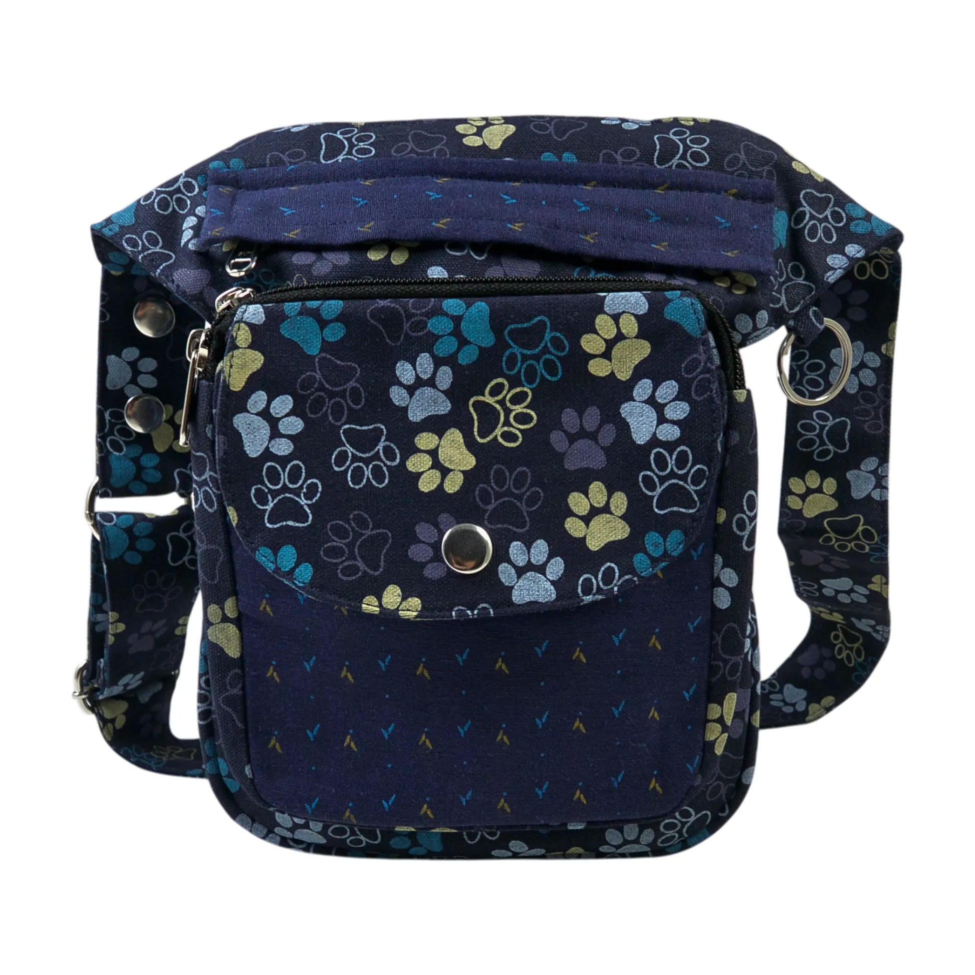 Nijens Gassitasche Hannover aus Canvas-Baumwolle in Blau-Lila mit Pfoten-Muster in Gelb, Frontansicht mit Druckknopfklappe, Reißverschlussfach und verstellbarem Gurt.