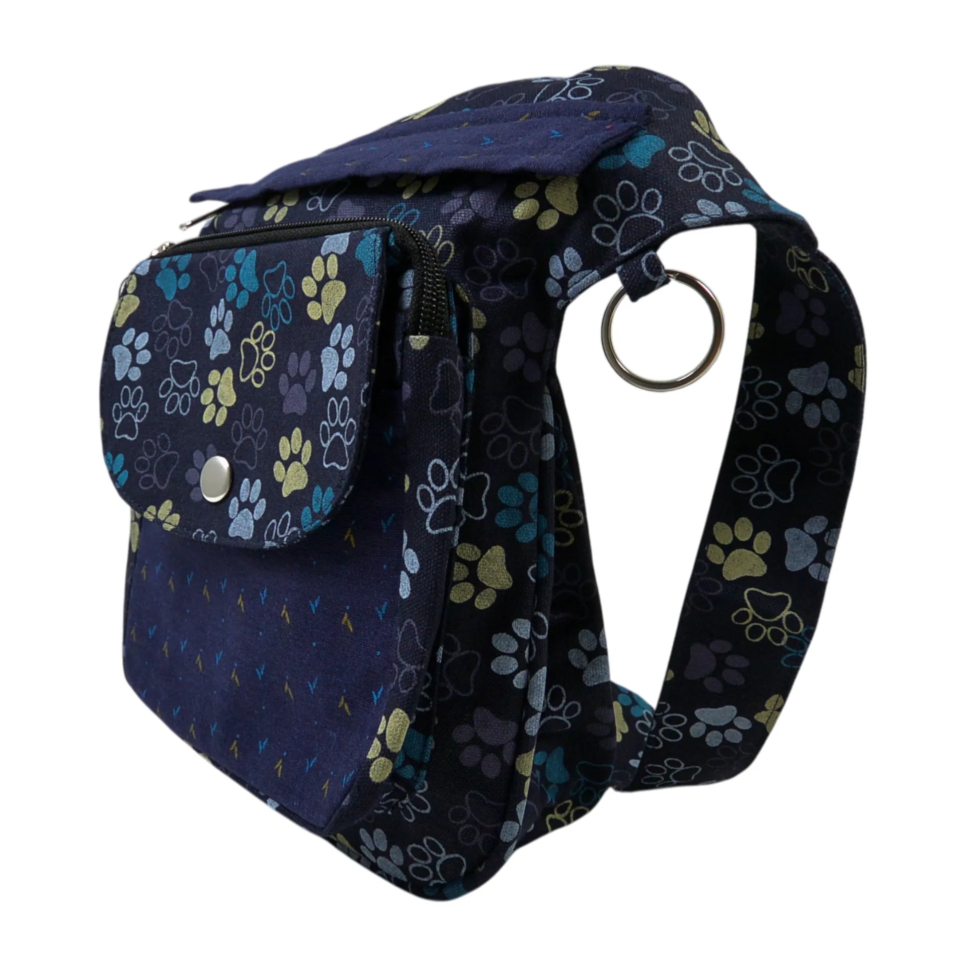 Nijens Gassitasche Hannover aus Canvas-Baumwolle in Blau-Lila mit Pfoten-Muster in Gelb, Seitenansicht mit Druckknopfklappe, Reißverschlussfach und verstellbarem Gurt.