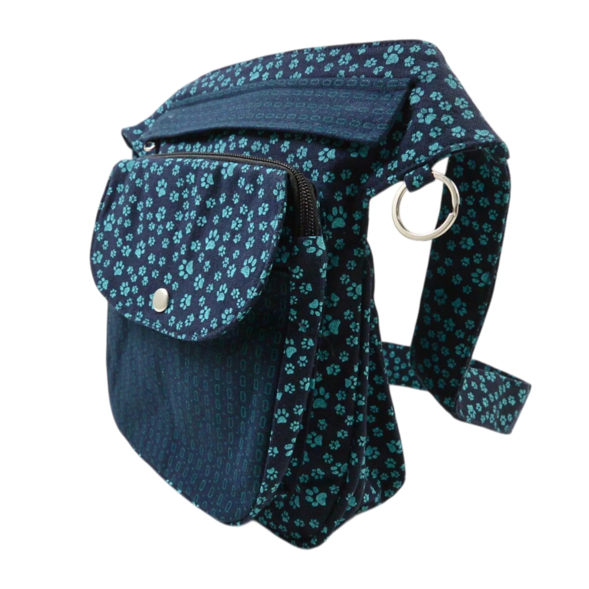 Gassitasche Hannover aus Canvas-Baumwolle in Marineblau mit türkisfarbenem Pfotenmuster. Seitenansicht.