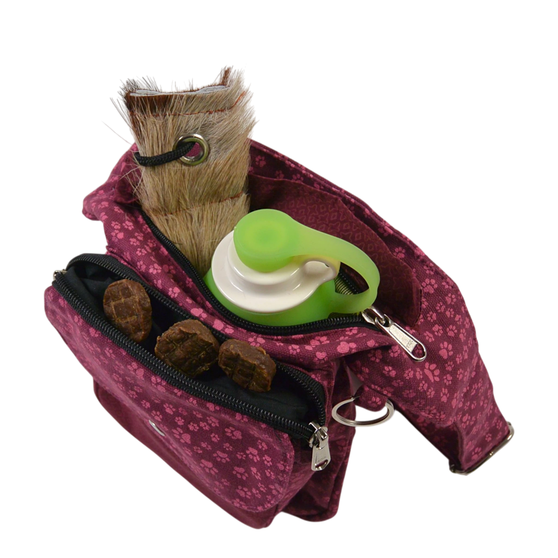 Magenta Nijens Gassi-Tasche Hannover mit Pfoten Print, mit aufgesetztem Leckerli-Fach, geöffnet und mit Hundekeksen gefüllt