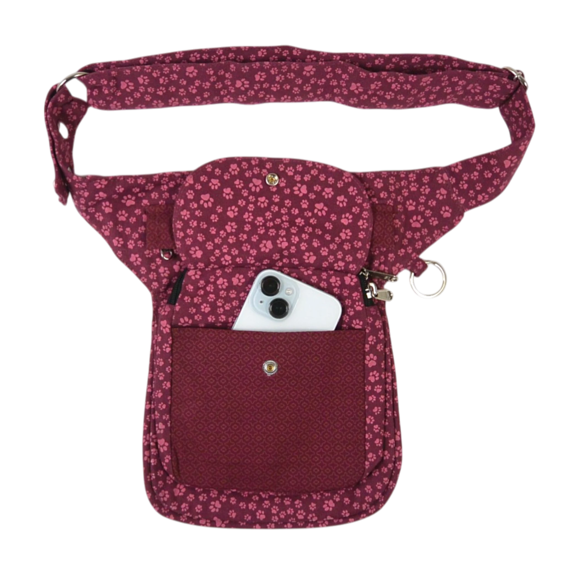 Vorderansicht der roten Nijens Gassi-Tasche Hannover mit farbenfrohem Pfotenmuster und Smartphone im Fach