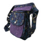 Nijens Gassitasche Hannover aus Canvas-Baumwolle in Blau mit buntem Pfotenmuster und violetter Mandala-Klappe, Seitenansicht mit Reißverschlussfach.
