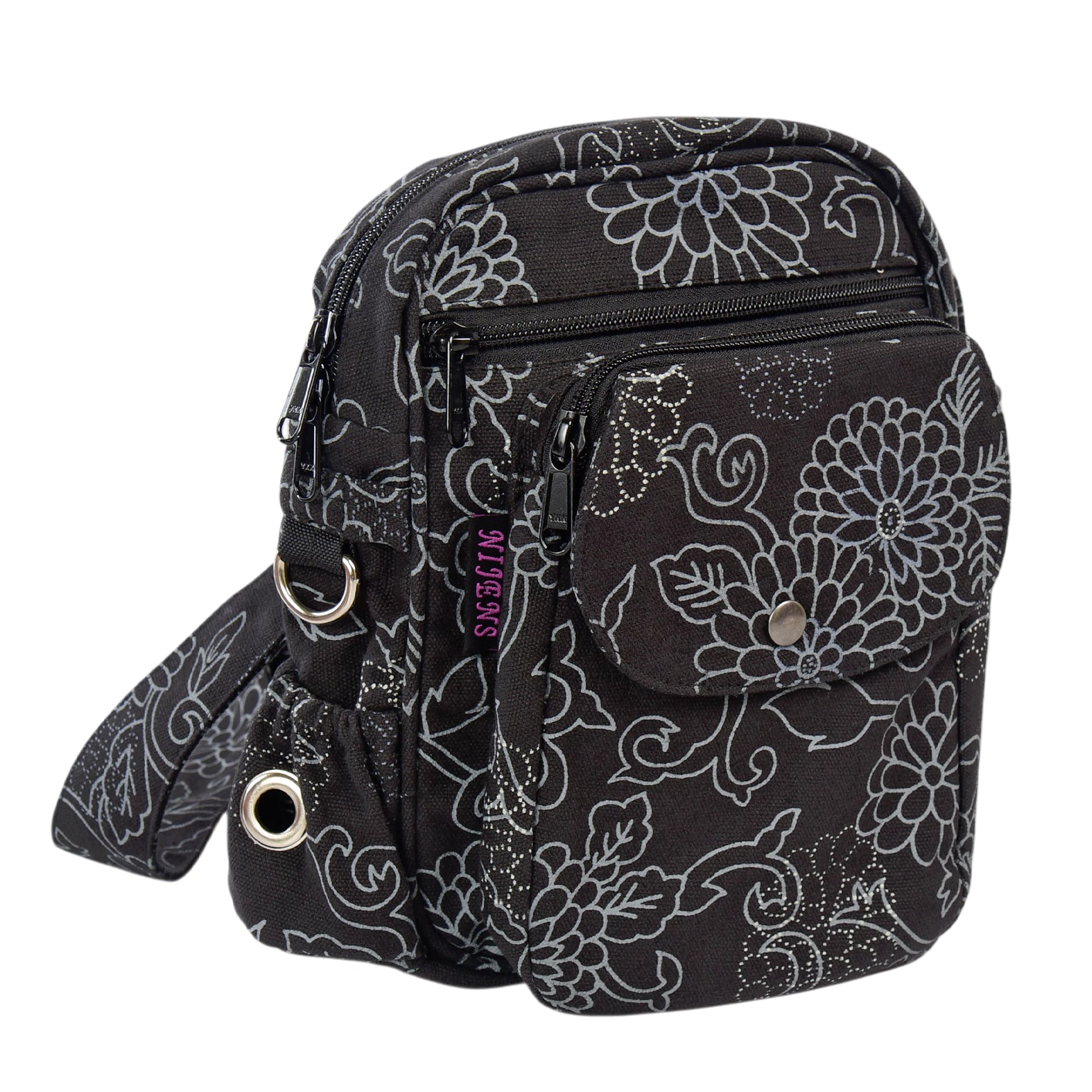 Seitenansicht der Tasche mit silbernen Ringen, Reißverschlüssen und Blumenmuster in Schwarz – funktional und dekorativ.