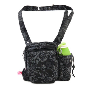 Nijens Gassitasche Konstanz mit schwarzem Blumenmuster, breitem Tragegurt, integriertem Kotbeutelspender und Flaschenhalter.