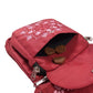 Leckerlitasche der Nijens Gassi-Tasche Hannover aus wasserabweisendem Polyesterstoff in Rot mit rosafarbener Mandala-Stickerei und Pfotenmotiv