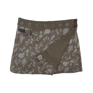 Wenderock für Kinder aus Baumwolle Beige mit Blumenmotiven und Druckknopfleiste.