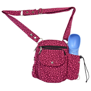 Rosafarbene Nijens-Gassitasche mit kleinen Pfotenmustern und blauer Trinkflasche – ideal für Spaziergänge mit dem Hund