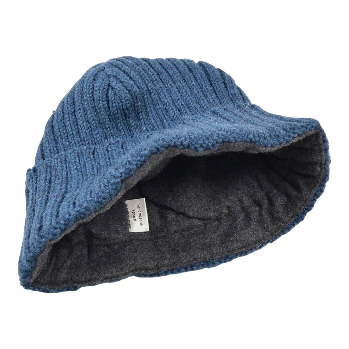 Kurze Beanie-Mütze Tulsipur in Petrol aus 100 % Schurwolle mit Umschlag. Innenansicht.