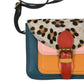 Kleine bunte Leder Umhängetasche mit Leo-Muster, farbigem Leder in Dunkelblau, Oange, Rosa und Rot.