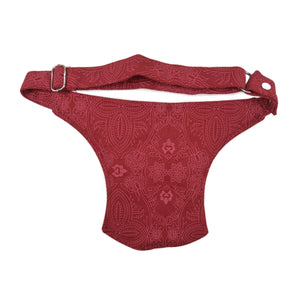 Hinteransicht: Gürteltasche, Bauchtasche aus Baumwollstoff mit Ornamenten und Schlangen Motive in Rot.