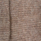 Detailaufnahme der weichen Strickstruktur der Nijens Balaclava in Beige