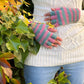 Fingerlose Handschuhe aus Schurwolle, Rosa/Türkis gestreift, mit Fleeceeinsatz. Nijens Shop.