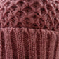 Strickmütze aus Schurwolle in Altrosa. 