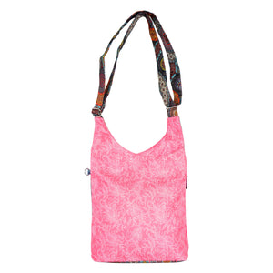 RIVER Shopper von Nijens – Wende-Umhängetasche mit floralen Muster in Rosa und gemustertem Riemen, wasserabweisend.