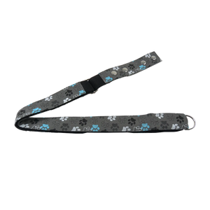 Gürtel aus Baumwolle Grau mit bunten Hundepfoten Print. Verschließbar mit zwei Druckknöpfen aus Metall. Stufenlos Größenverstellbar mit Leiterschnalle.