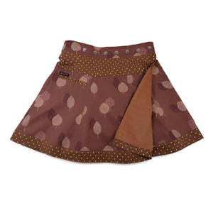 Beidseitig tragbarer Cordrock von Nijens – wendbar mit Dots und kleiner Tasche. Verstellbarer Bund, Rotbraun mit Blatmotiven.