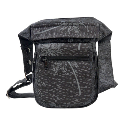 Gürteltasche Schwarz mit Palmen Motiv. Sie verfügt über 4 Reißverschlussfächer. Der Gurt ist größenverstellbar.