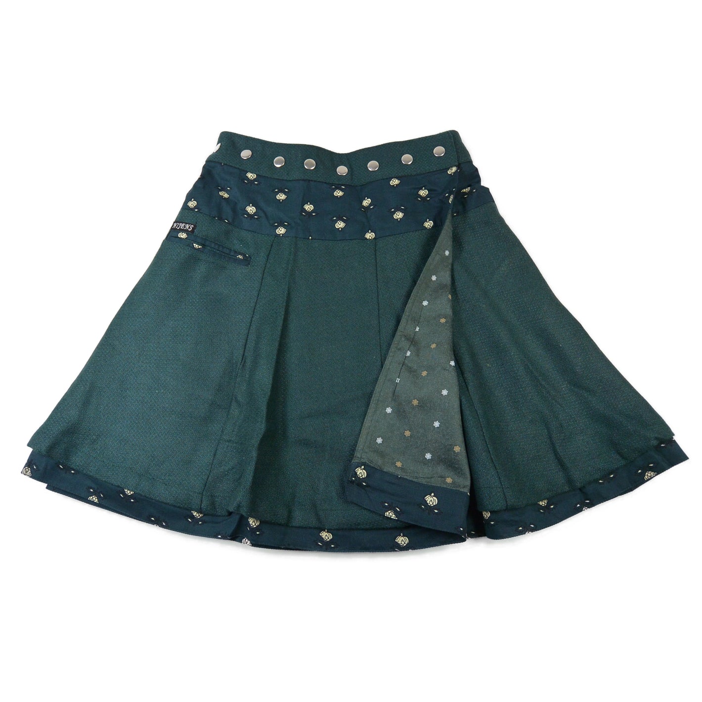 Reversibler Nijens Winter-Wenderock in Dunkelgrün mit floralem Bund und Innenseite. Warmer Wickelrock mit zwei Designs.