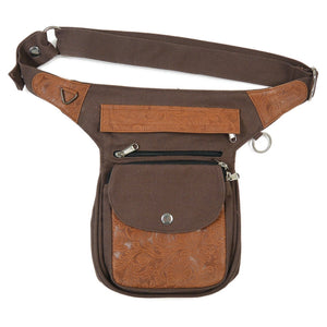 Gesamtansicht der Gassi-Tasche mit geprägtem Leder, Canvas-Gurt und silbernem Druckknopf.