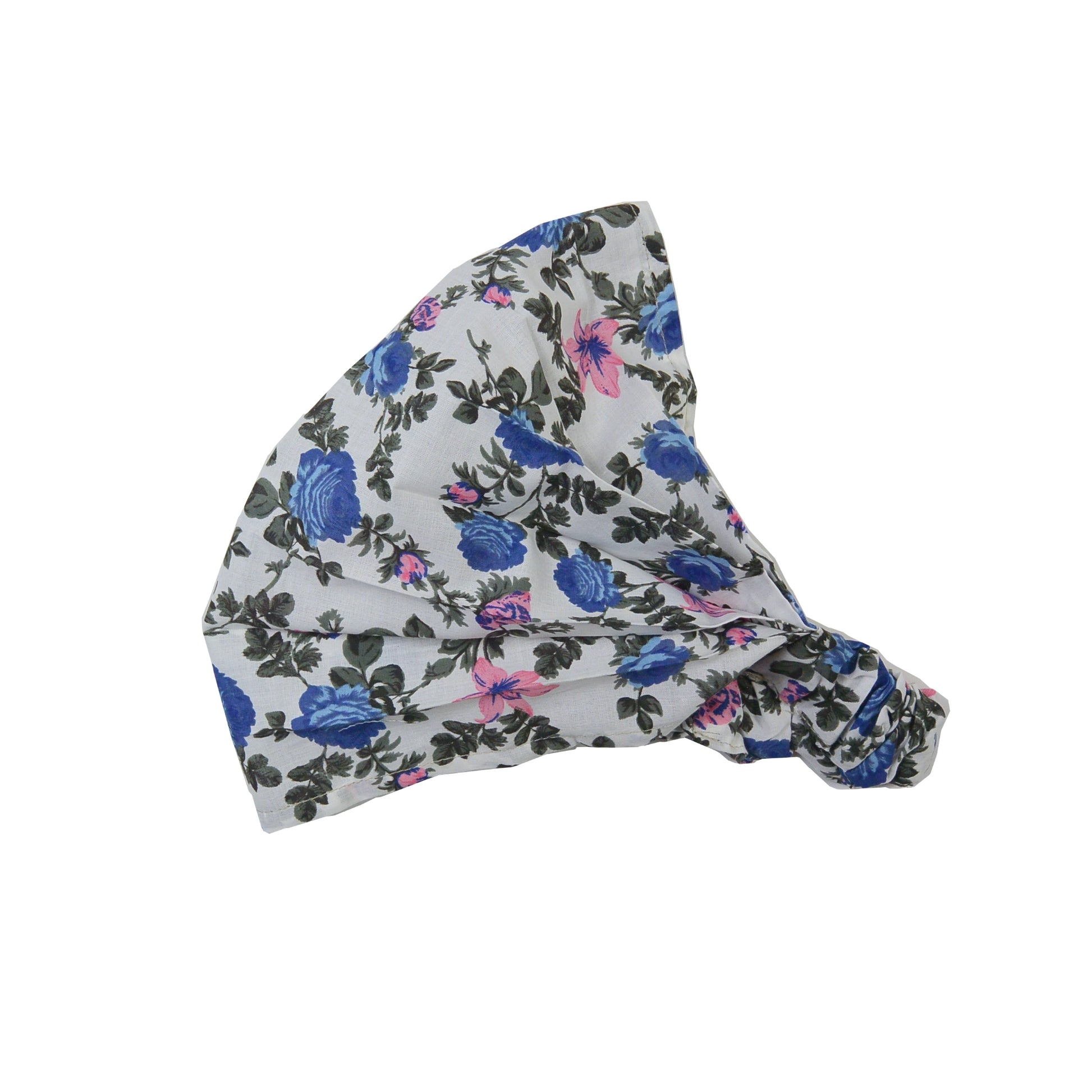 Nijens Stoff-Haarband in Weiß mit Blumenmuster in Blau, Rostorange, seitlich liegend vor weißem Hintergrund