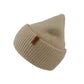 Seitenansicht der Angora Beanie in Beige von Nijens mit Pfote-&-Herz-Stickerei